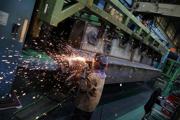 A Hanwha Aerospace engineer works on a KAAV (Korean Amphibious Assault Vehicle) at Hanwha Aerospace factory in Changwon. (REUTERS)