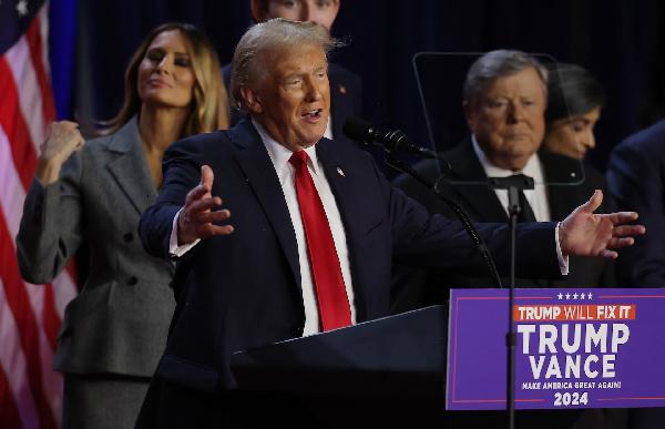 Donald Trump takes the stage with his wife Melania to address supporters at his rally, at the Palm Beach County Convention Center in West Palm Beach, Florida, Nov. 6. (REUTERS)