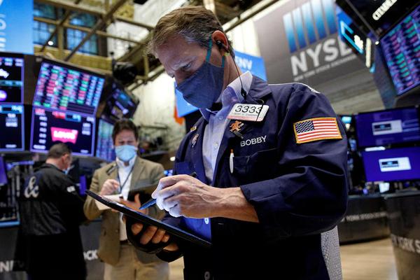 Traders work on the floor of the New York Stock Exchange (NYSE) in New York City. (REUTERS)