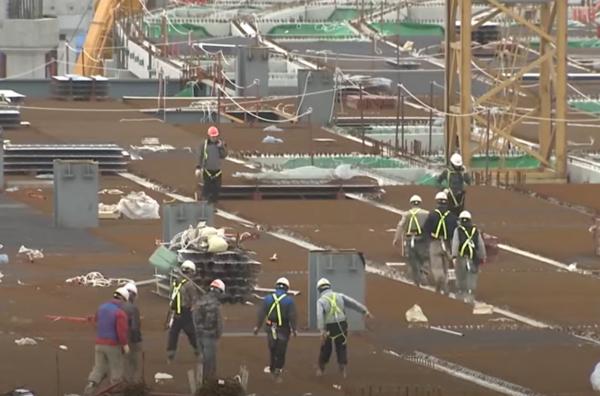 Workers at a construction site (Captured from SBS)