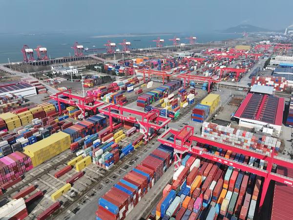 A drone view shows containers and cargo ships at a port in Wuhu, Anhui province, China, Feb. 4, 2025. China Daily via REUTERS