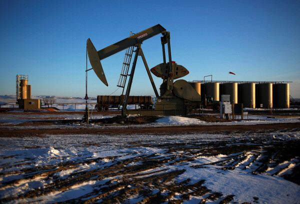 An oil drilling pump site is seen in McKenzie County outside of Williston, N.D., on March 12, 2013. Reuters